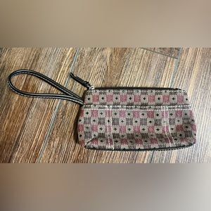 Wristlet. Inside compartment and outside slit pocket.